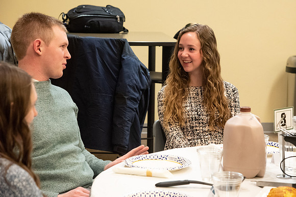 Faculty and staff of Housing and Student Living gather for an early morning breakfast and inspiration.