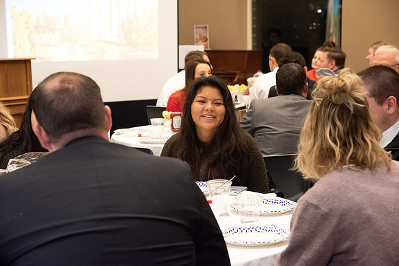 Faculty and staff of Housing and Student Living gather for an early morning breakfast and inspiration.