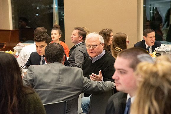 Faculty and staff of Housing and Student Living gather for an early morning breakfast and inspiration.