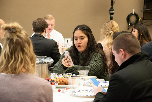 Faculty and staff of Housing and Student Living gather for an early morning breakfast and inspiration.