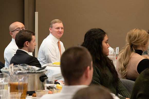 Faculty and staff of Housing and Student Living gather for an early morning breakfast and inspiration.