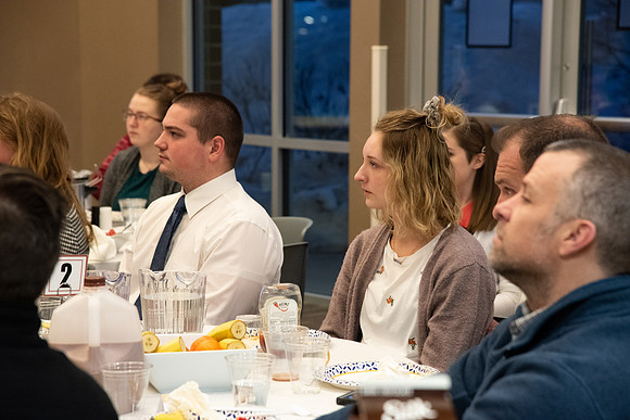 Faculty and staff of Housing and Student Living gather for an early morning breakfast and inspiration.