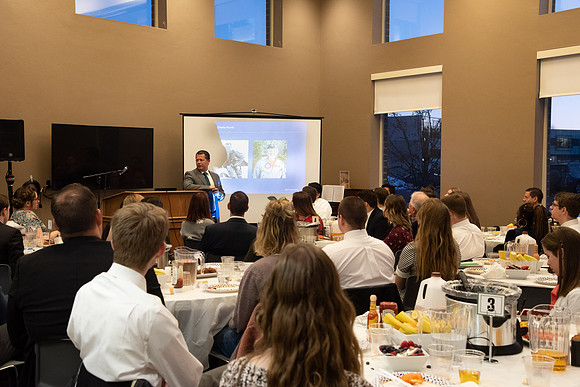 Faculty and staff of Housing and Student Living gather for an early morning breakfast and inspiration.