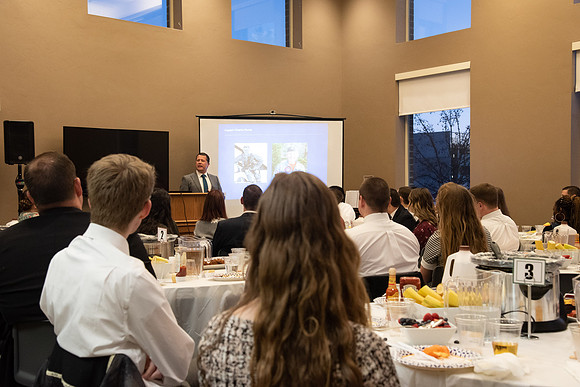Faculty and staff of Housing and Student Living gather for an early morning breakfast and inspiration.