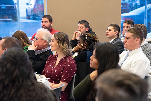 Faculty and staff of Housing and Student Living gather for an early morning breakfast and inspiration.