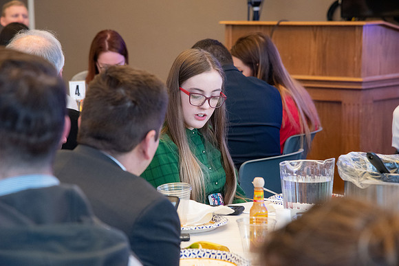 Faculty and staff of Housing and Student Living gather for an early morning breakfast and inspiration.