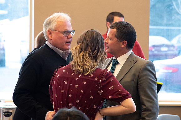 Faculty and staff of Housing and Student Living gather for an early morning breakfast and inspiration.