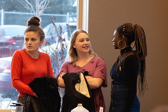 Faculty and staff of Housing and Student Living gather for an early morning breakfast and inspiration.