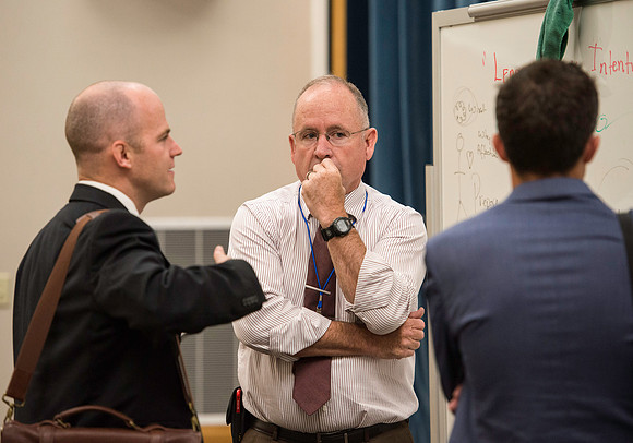 Faculty gather in the Hinckley Building for a conference to learn from their peers.