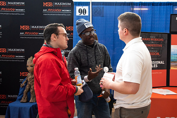 Students meet with different businesses for potential internships and jobs at a career fair at BYU-Idaho.