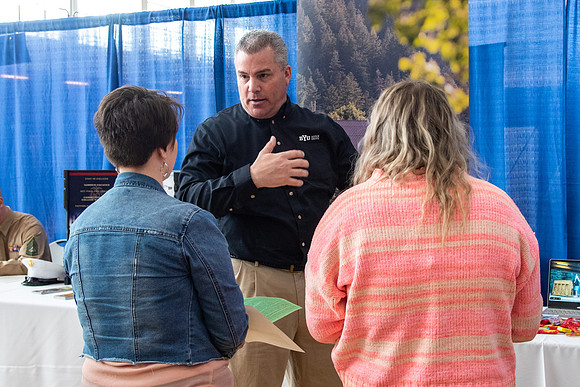 Students meet with different businesses for potential internships and jobs at a career fair at BYU-Idaho.