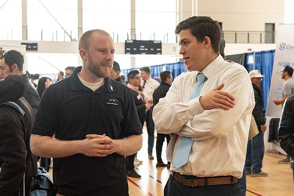Students meet with different businesses for potential internships and jobs at a career fair at BYU-Idaho.