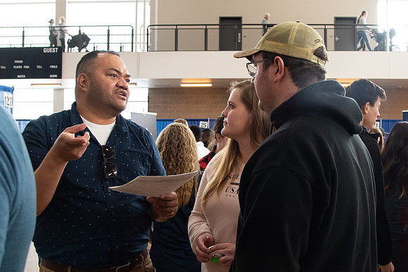 Students meet with different businesses for potential internships and jobs at a career fair at BYU-Idaho.