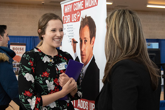 Students meet with different businesses for potential internships and jobs at a career fair at BYU-Idaho.