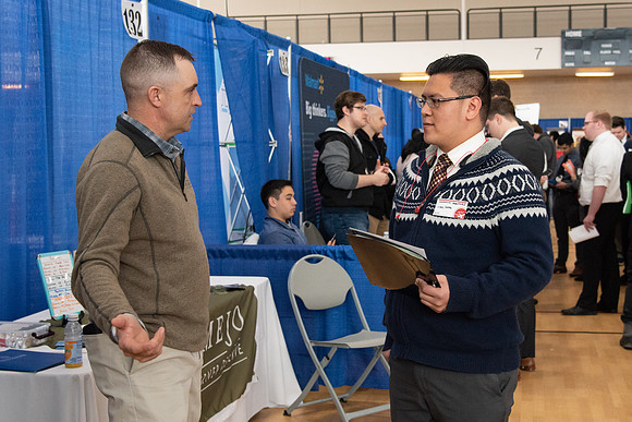 Students meet with different businesses for potential internships and jobs at a career fair at BYU-Idaho.
