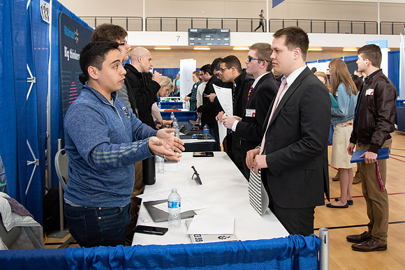 Students meet with different businesses for potential internships and jobs at a career fair at BYU-Idaho.
