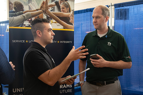 Students meet with different businesses for potential internships and jobs at a career fair at BYU-Idaho.