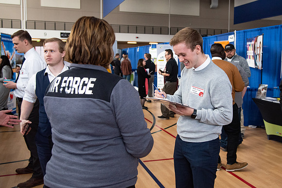 Students meet with different businesses for potential internships and jobs at a career fair at BYU-Idaho.