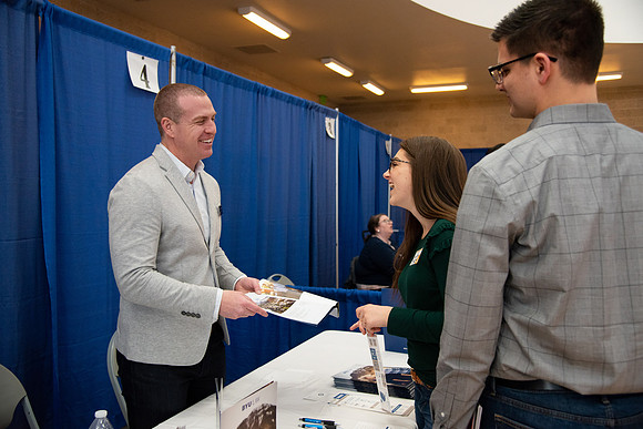 Students meet with different businesses for potential internships and jobs at a career fair at BYU-Idaho.