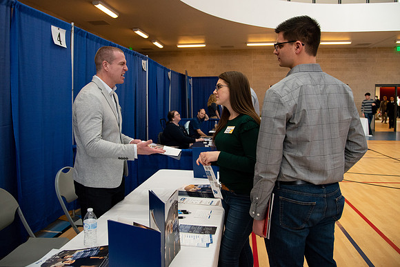 Students meet with different businesses for potential internships and jobs at a career fair at BYU-Idaho.