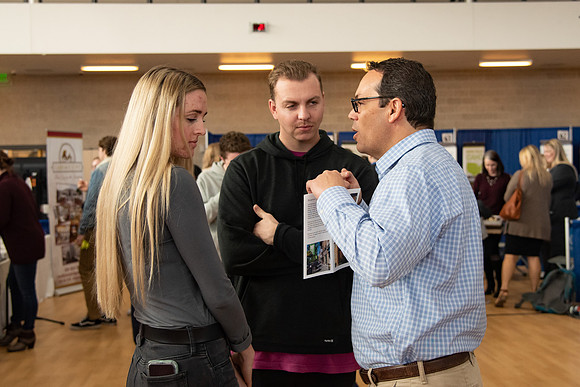 Students meet with different businesses for potential internships and jobs at a career fair at BYU-Idaho.