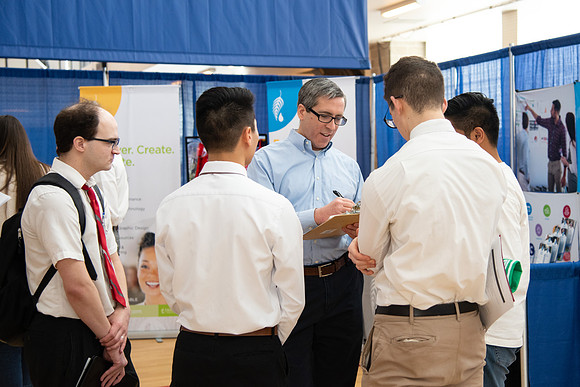 Students meet with different businesses for potential internships and jobs at a career fair at BYU-Idaho.