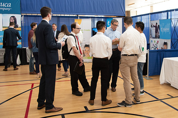 Students meet with different businesses for potential internships and jobs at a career fair at BYU-Idaho.