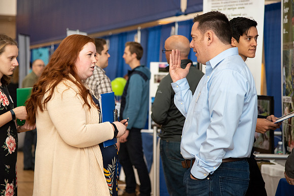 Students meet with different businesses for potential internships and jobs at a career fair at BYU-Idaho.
