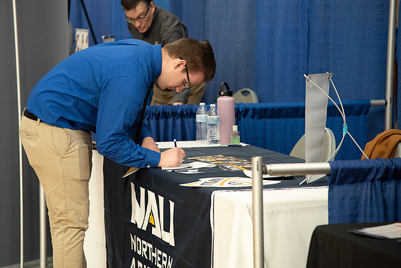 Students meet with different businesses for potential internships and jobs at a career fair at BYU-Idaho.