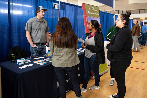 Students meet with different businesses for potential internships and jobs at a career fair at BYU-Idaho.