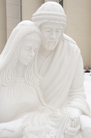 Light snow was faling around the Nativity Decorations outside the Taylor Building.