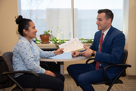 BYU-Idaho Career Center. Student handing out her resume. (photo illustration)