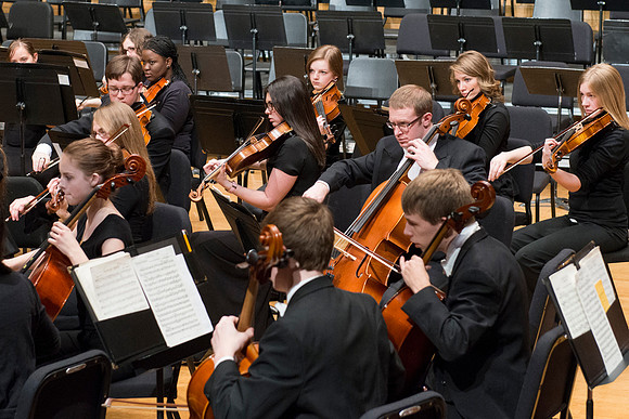 Students in the University Orchestra  during a dress rehearsal in preperation before their end of the semester concert.