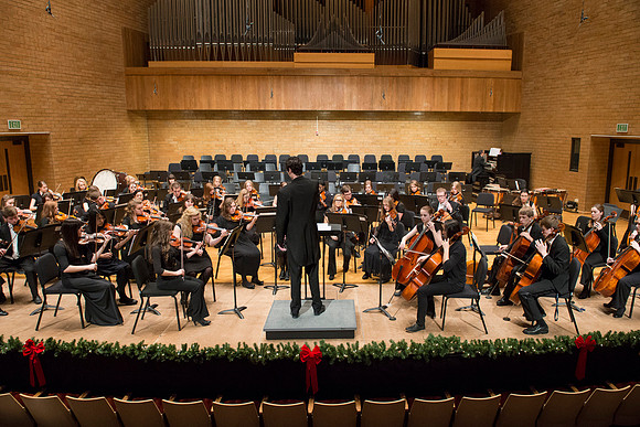 Students in the University Orchestra  during a dress rehearsal in preperation before their end of the semester concert.