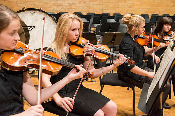 Students in the University Orchestra  during a dress rehearsal in preperation before their end of the semester concert.
