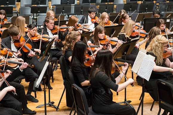 Students in the University Orchestra  during a dress rehearsal in preperation before their end of the semester concert.