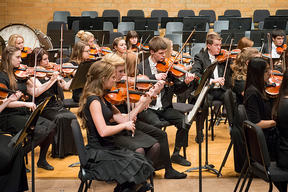 Students in the University Orchestra  during a dress rehearsal in preperation before their end of the semester concert.