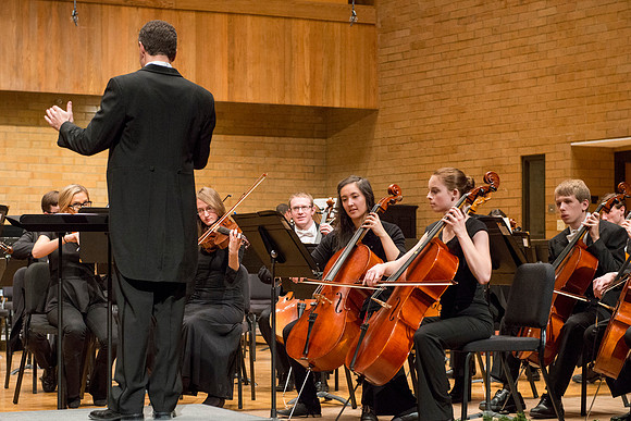 Students in the University Orchestra  during a dress rehearsal in preperation before their end of the semester concert.
