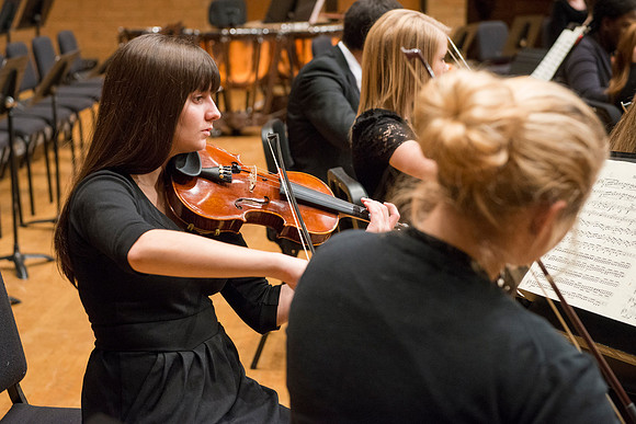 Students in the University Orchestra  during a dress rehearsal in preperation before their end of the semester concert.