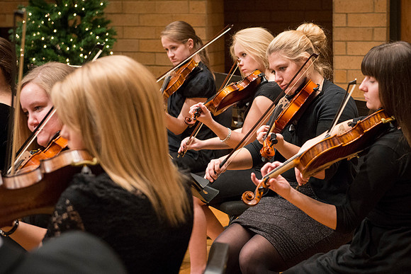 Students in the University Orchestra  during a dress rehearsal in preperation before their end of the semester concert.
