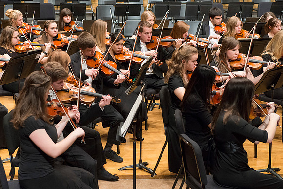 Students in the University Orchestra  during a dress rehearsal in preperation before their end of the semester concert.