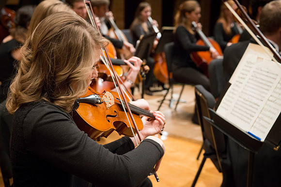 Students in the University Orchestra  during a dress rehearsal in preperation before their end of the semester concert.
