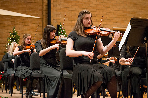 Students in the University Orchestra  during a dress rehearsal in preperation before their end of the semester concert.