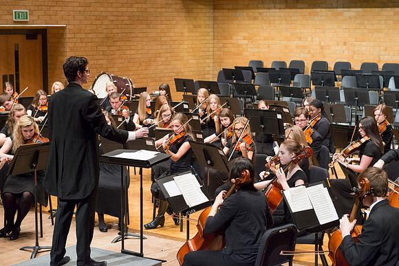 Students in the University Orchestra  during a dress rehearsal in preperation before their end of the semester concert.