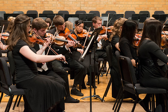 Students in the University Orchestra  during a dress rehearsal in preperation before their end of the semester concert.