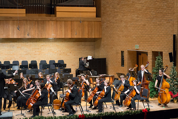 Students in the University Orchestra  during a dress rehearsal in preperation before their end of the semester concert.