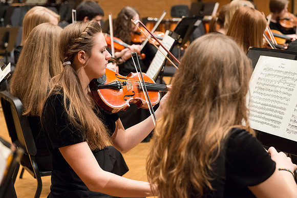 Students in the University Orchestra  during a dress rehearsal in preperation before their end of the semester concert.
