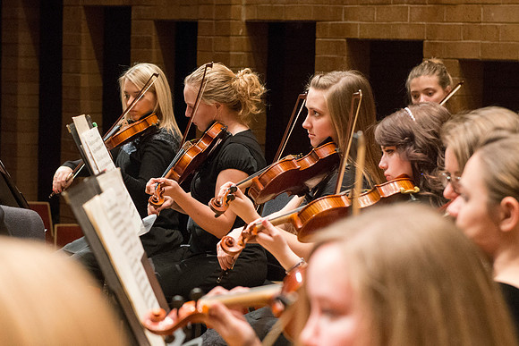 Students in the University Orchestra  during a dress rehearsal in preperation before their end of the semester concert.