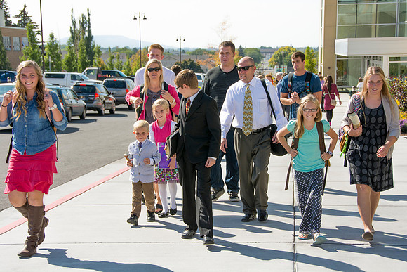 Family walking back from attending Elder Hollands devotional