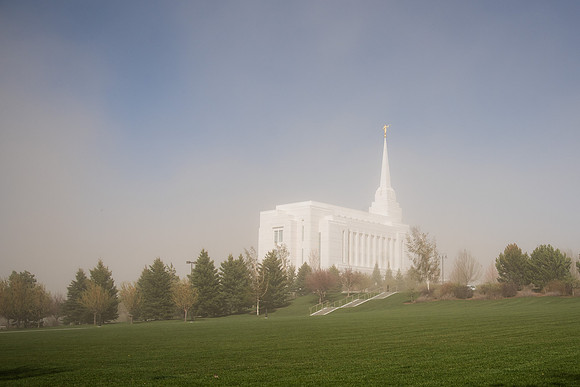 Rexburg Idaho Temple surrounded by dust during a wind storm.
